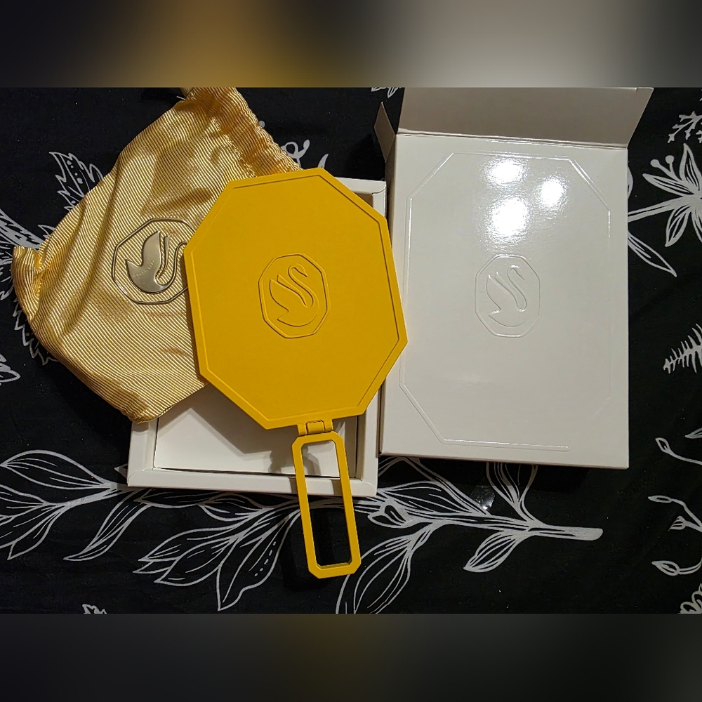 Swarovski hand mirror, likely a compact or makeup mirror.